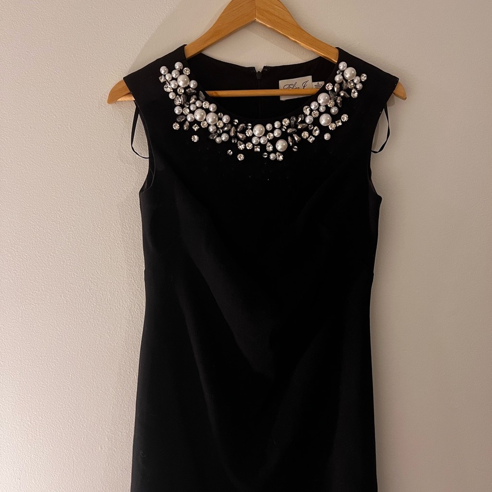 Elegant Black Dress with Pearl Embellishments